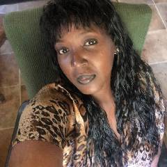 Ebony mature woman, dark hair, normal build